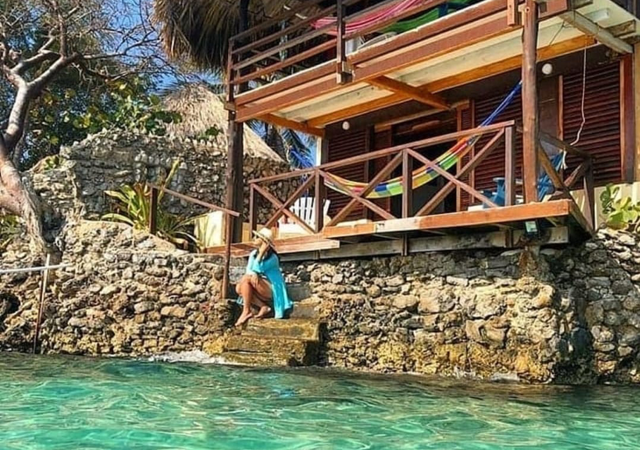 Woman on the edge of a flowing Island home